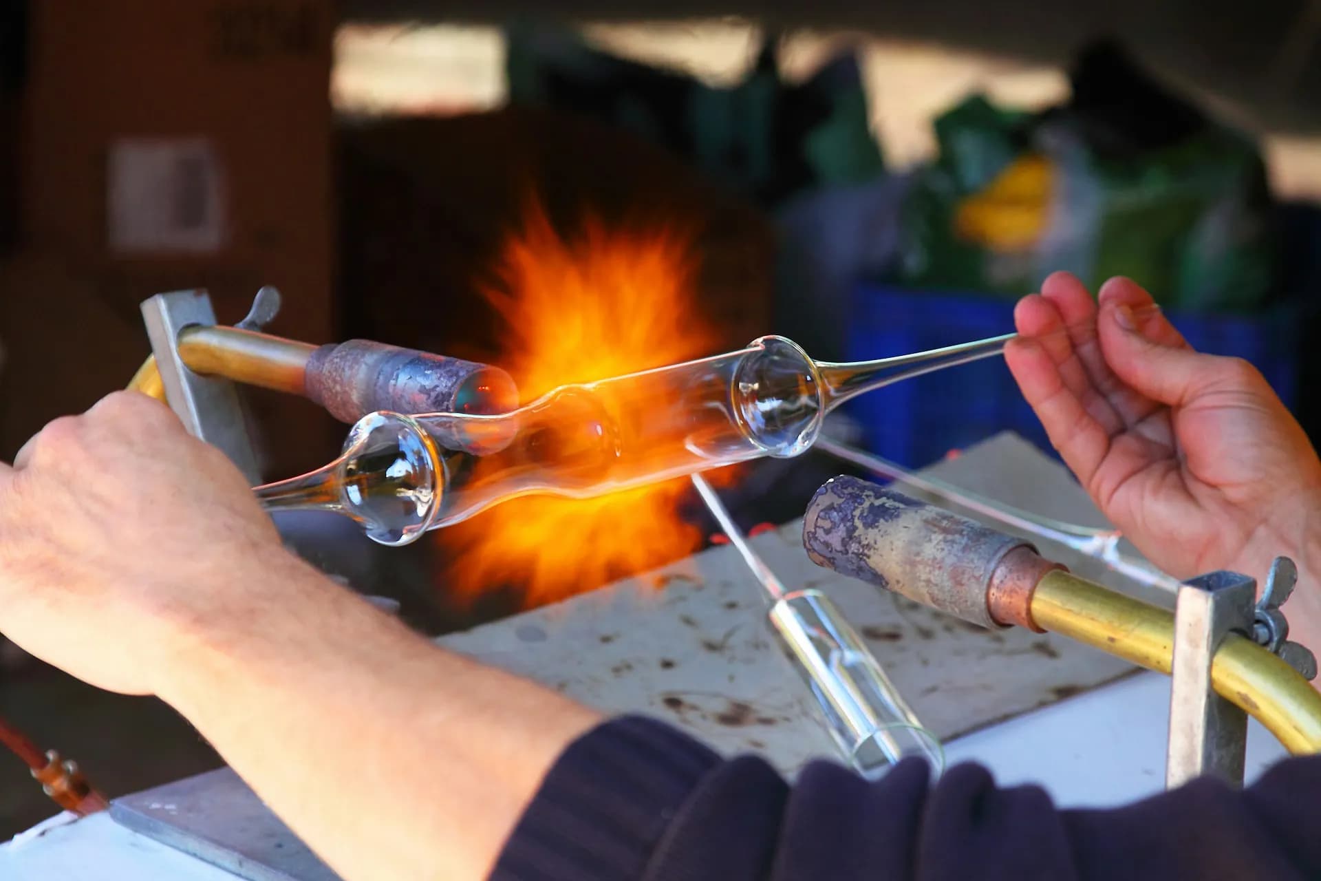 A person working on a glass product 